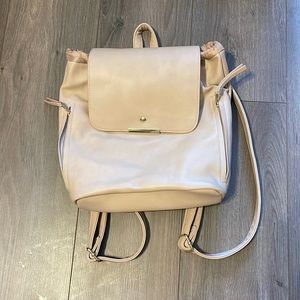 beige purse backpack